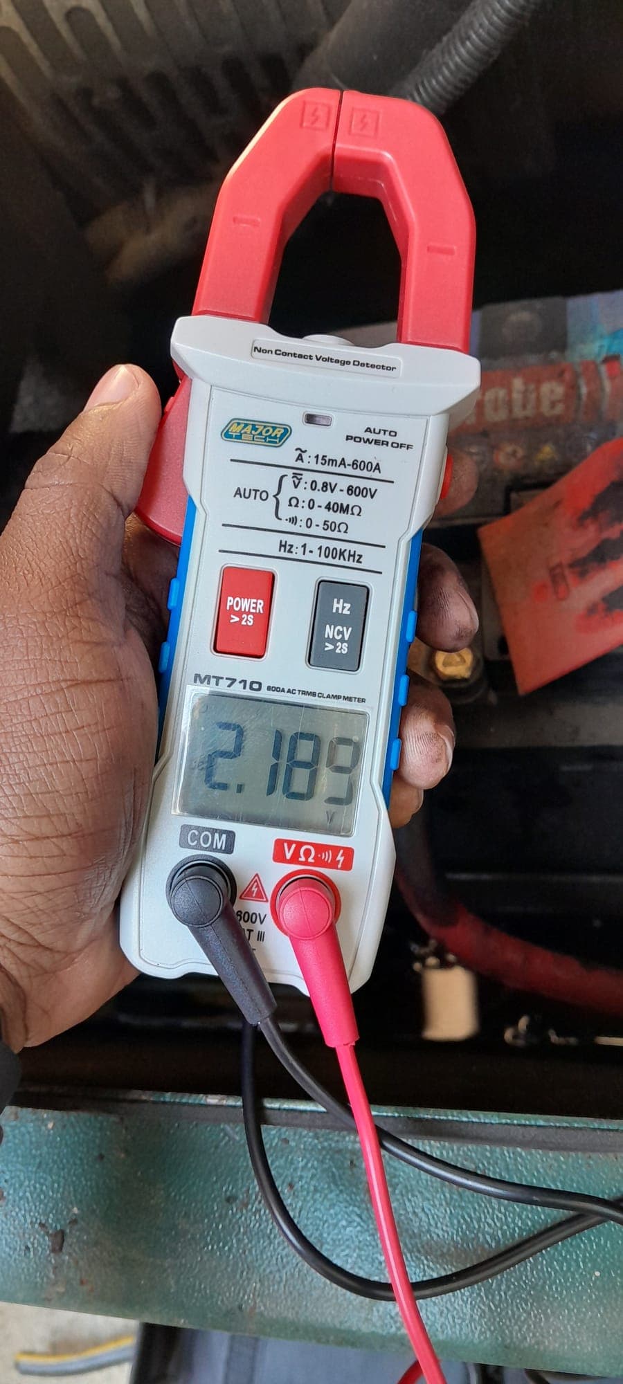 Clamp meter reading taken on a battery during an electrical maintenance visit